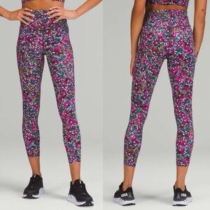 Lululemon Base Pace High-Rise Running Tight 25"
Floral Electric Leggings.     B